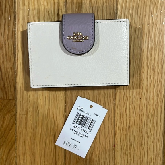Coach Handbags - 💗Coach white wallet with button closure